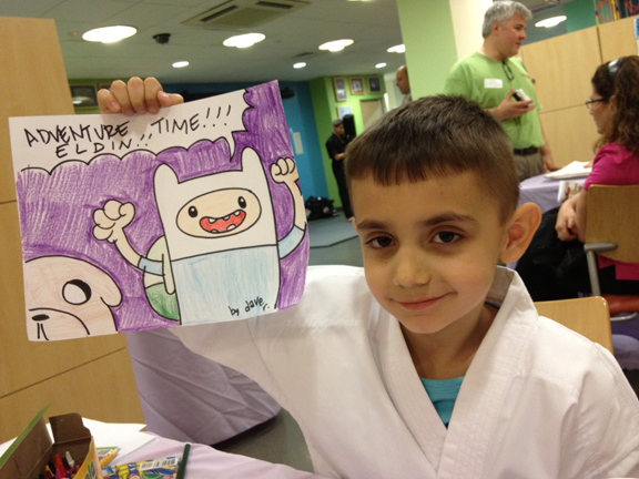 Kid with Adventure Time drawing